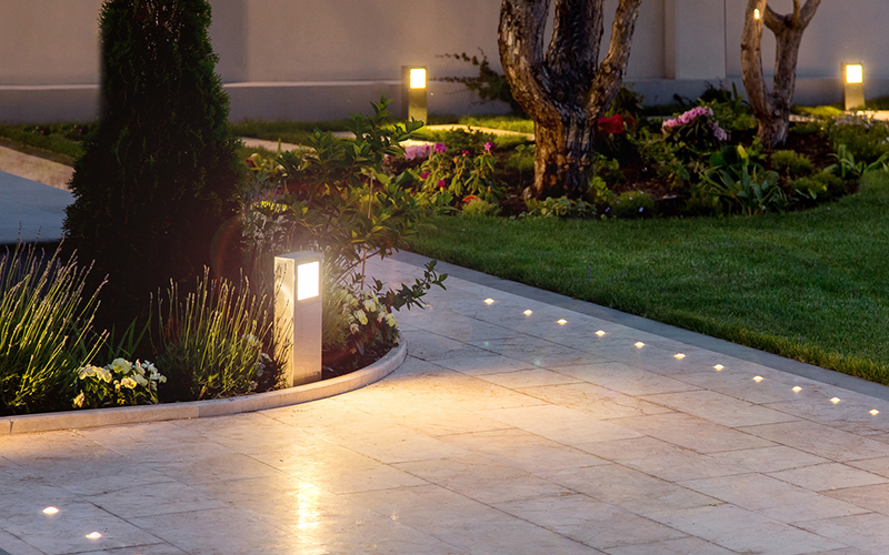 Landscaped garden with recessed in-ground lights and bollards